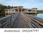 Boardwalk and visitor center at Green Cay Nature Center and Wetlands in Boynton Beach, Florida at sunrise.