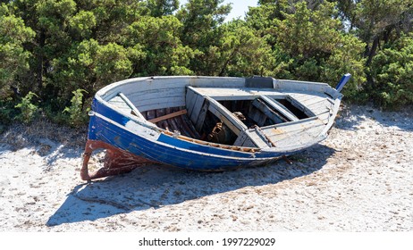 Boat Abandoned On Italian Beaches By Immigrants Who Crossed The Mediterranean Sea. Migrants Who Come From African Countries