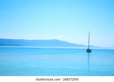 boat alone in the sea on a clear summer day