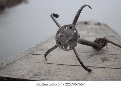 The boat anchor on the wharf and the background is blurred - Shutterstock ID 2257457667