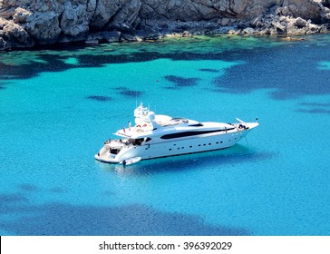 boat anchored in a bay, luxury yacht           - Powered by Shutterstock