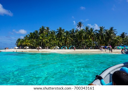 Boat arriving in Johnny Cay Island, Archipelago of San Andres, Colombian Caribbean.