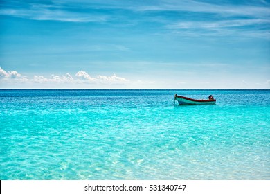 The boat in the Caribbean Sea on a sunny day. Clear water. - Powered by Shutterstock
