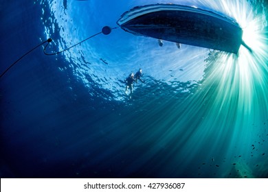 Boat Chain Anchor From Underwater With Sun Rays