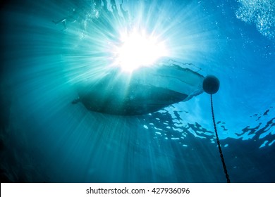 Boat Chain Anchor From Underwater With Sun Rays