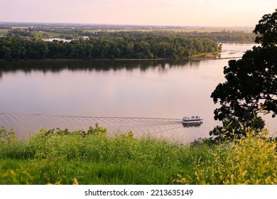 Boat Cruise Up The Mississippi River With Summer Dusk Light