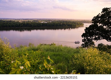 Boat Cruise Up The Mississippi River With Summer Dusk Light