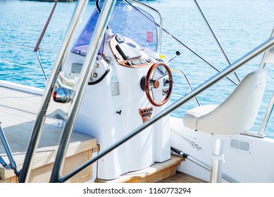 Boat Deck With Steering Wheel Close Up. Summer Time