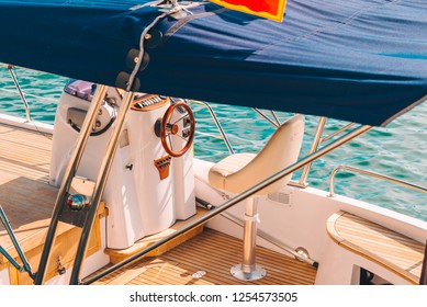 Boat Deck With Steering Wheel Close Up. Summer Time