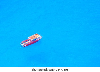 Boat In Deep Blue Water View From Above