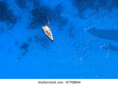 Boat In Deep Blue Water View From Above