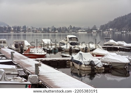 Boat dock at Lugano Lake in winter.