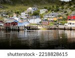 Boat dock scene at a small Atlantic Canada fishing village in Petty Harbour Newfoundland.