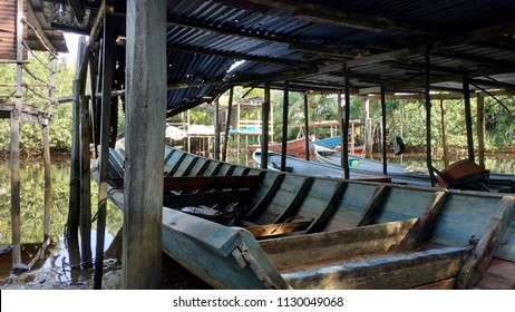 Boat dock in village - Shutterstock ID 1130049068