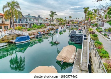 Boat Docks And Stairs At A Calm Canal In Long Beach California Neighborhood