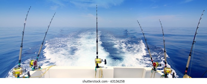 boat fishing trolling panoramic rod and reels blue sea wake [Photo Illustration]