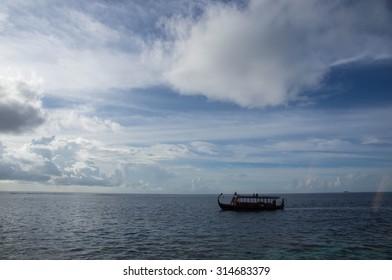 Boat floating on the ocean on a cloudy day