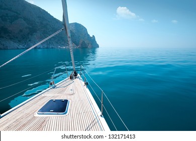  boat floats near the shore. Luxury Lifestyle