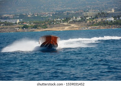 The Boat At High Speed Performs A Sharp Turn, Spraying Water To The Sides