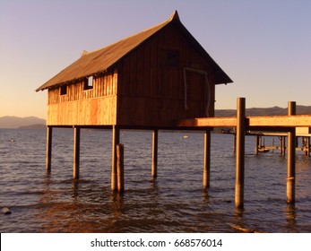 Boat House On Stilts At Dusk On The South Shore Of Lake Tahoe, CA On A Clear Day