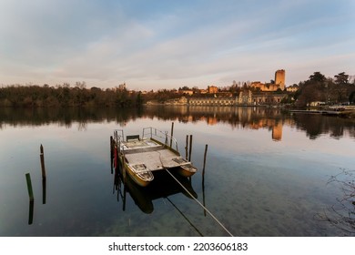 A Boat Inside Adda River In Front Of Power Plant, Trezzo D'Adda, Po Valley