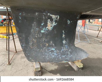 Boat Keel In Boat Yard On Blocks Supported By Jack Stands