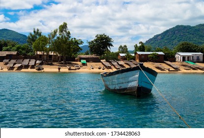 Boat in Lake Malawi with nice view of the coast and beach.
