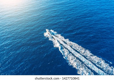 Boat Launch At High Speed Floats To Sunlight In The Mediterranean, Aerial Top View