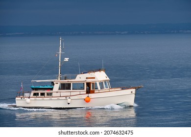 Boat navigating in the Mediterranean Sea at dawn in quiet waters