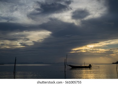 Boat on the beach with a cloud