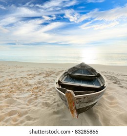 Boat On The Beach At Sunrise Time