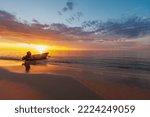 Boat on the beach at sunset. Eighty Mile Beach, Western Australia.