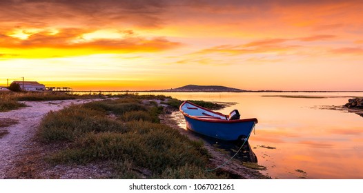 Boat On The Etang De Thau At Sunrise, Near Sète In Occitanie, In Herault, France