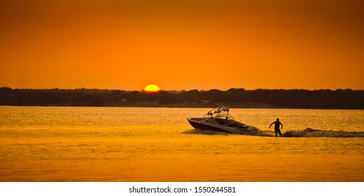 Boat On A Lake At Sunset