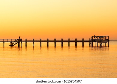 Boat On A Boat Lift At Sunset