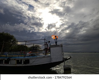 Boat on the River with Cloudy Sky