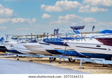 Boat on stand on the shore, close up on the part of the yacht, luxury ship, maintenance and parking place boat, marine industrial