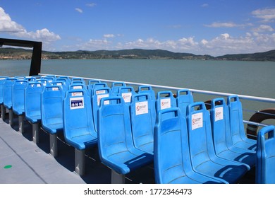 Boat on the Trasimeno Lake where available places are marked with signals  for emergency covid 19 in order to social distance on the means of transport, economic and tourism crisis in summer, Umbria - Shutterstock ID 1772346473