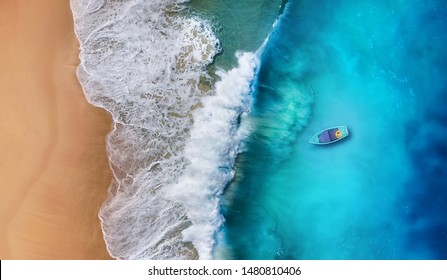 Boat on the water surface from top view. Turquoise water background from top view. Summer seascape from air. Travel - image - Shutterstock ID 1480810406