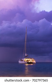 A Boat Out At Sea After The Sun Sets Near Canouan Island.