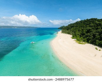 Boat over clear water in Puka Shell Beach with white sand. Boracay Island. Philippines. - Powered by Shutterstock