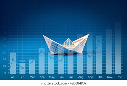 Boat paper with graph on blue ocean .Business goal concept