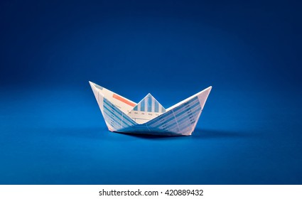 Boat paper graph on blue ocean .Business goal concept