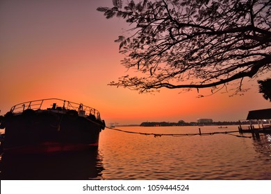 A boat parked in a jetty in Vembanad Lake in Marine Drive, Kochi.
