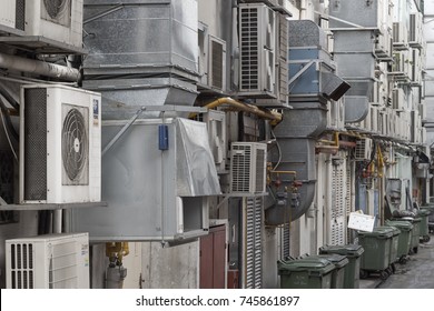 BOAT QUAY, SINGAPORE - AUGUST 2017: Rows of air conditioners and trash containers behind the restaurants at Boat Quay.