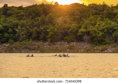 Boat Racing under sunset sky - Powered by Shutterstock