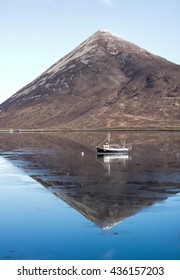 boat in a reflection.