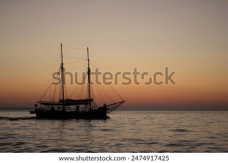 Boat sailing during sunset in the Mediterranean sea