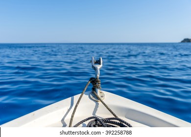 Boat Sailing On The Deep Blue Aegean Sea. Close-up Shot.