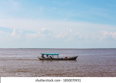 Boat Sailing On The Waters Of The Tapajós River - Santarém, State Of Pará, Brazil